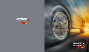 Dynamic wheels of a sports car in a blurred motion on a grey backdrop