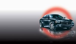 Black luxury business class sedan in a red glowing circle on grey gradient