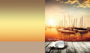 Pearl in a shell against the marina at yellow-tan sea sunset