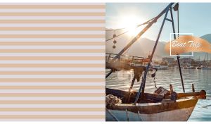 An old fishing boat in the sun rays on a pastel beige and gray striped backdrop