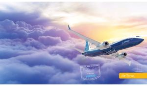 Front view of a white and navy airplane above the purple clouds in the yellow sky