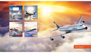 Elevated view of a white airplane above the pastel white clouds in the orange sunset