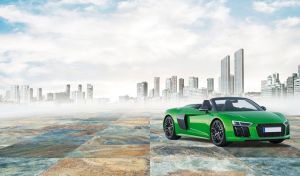 Bright green sports convertible against white and blue background of urban mist