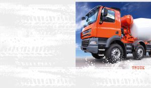 Red cement truck on a sunny road against a white background with tire tracks