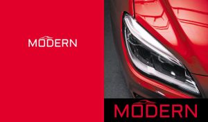 Close-up of a cherry red modern sports car headlight on red