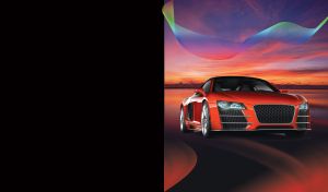 Red coupe with honeycomb grill and big alloy wheels at sunset background