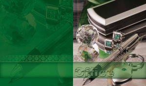 Crystal ball, silver cufflinks, fountain pen and a keyring on a silver desk